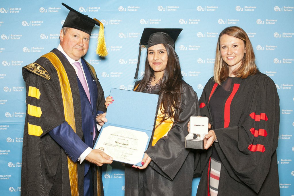 Joshi receiving her award for the highest graduate GPA, Switzerland, 2015